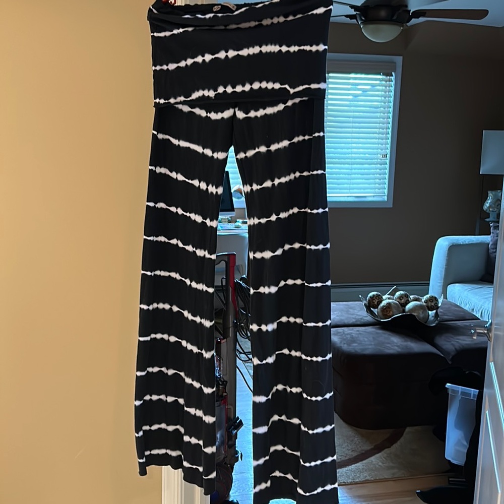 Black and white striped flare yoga pants with a fold over band
